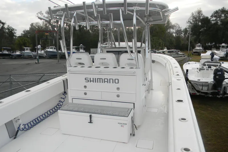  Yacht Photos Pics 2022 Contender 39 ST boat with Shimano branding, docked in a marina.