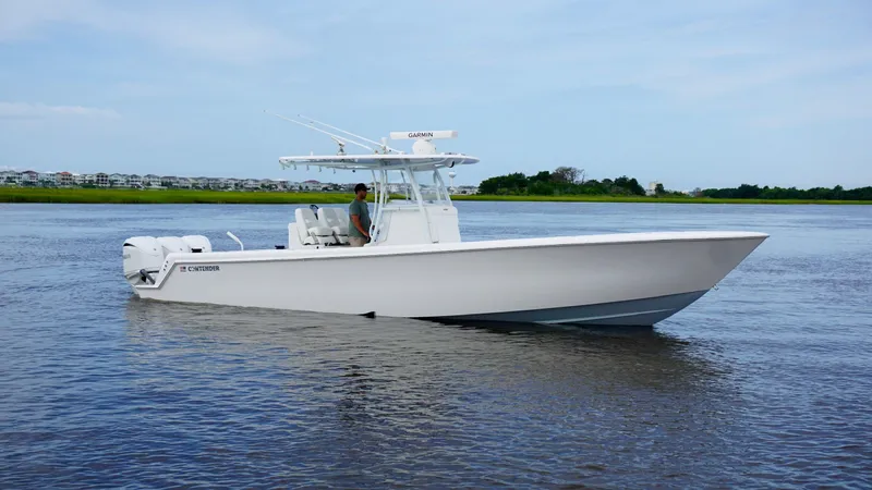  Yacht Photos Pics 2023 Contender 35 ST boat cruising on calm water.