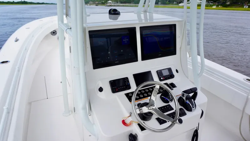 Yacht Photos Pics 2023 Contender 35 ST boat console with dual screens and steering wheel.