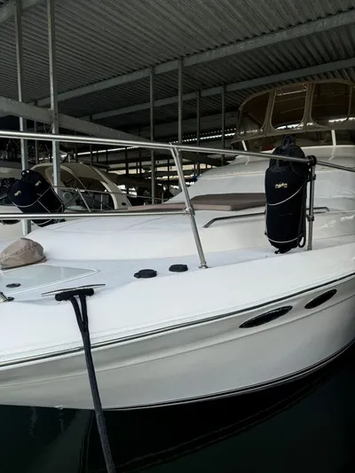  Yacht Photos Pics 1996 Sea Ray 400 Sedan Bridge yacht docked in covered marina.