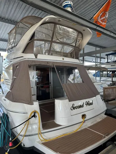  Yacht Photos Pics 1996 Sea Ray 400 Sedan Bridge yacht docked, named "Second Wind," with covered upper deck.