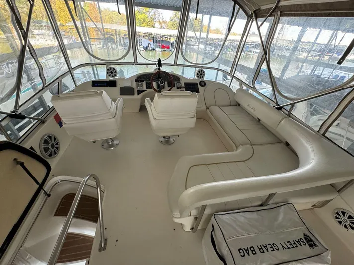  Yacht Photos Pics Interior of 1996 Sea Ray 400 Sedan Bridge yacht with white seating and helm.