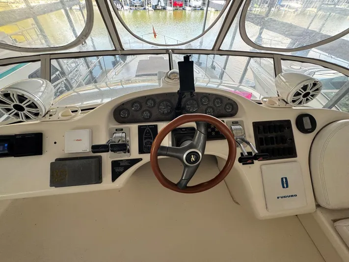 Yacht Photos Pics 1996 Sea Ray 400 Sedan Bridge helm with steering wheel and instrument panel.