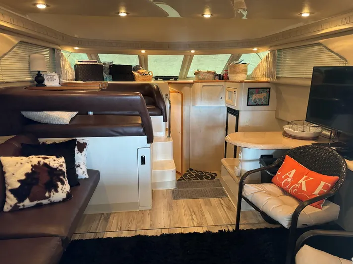  Yacht Photos Pics Interior of 1996 Sea Ray 400 Sedan Bridge yacht with cozy seating and modern decor.
