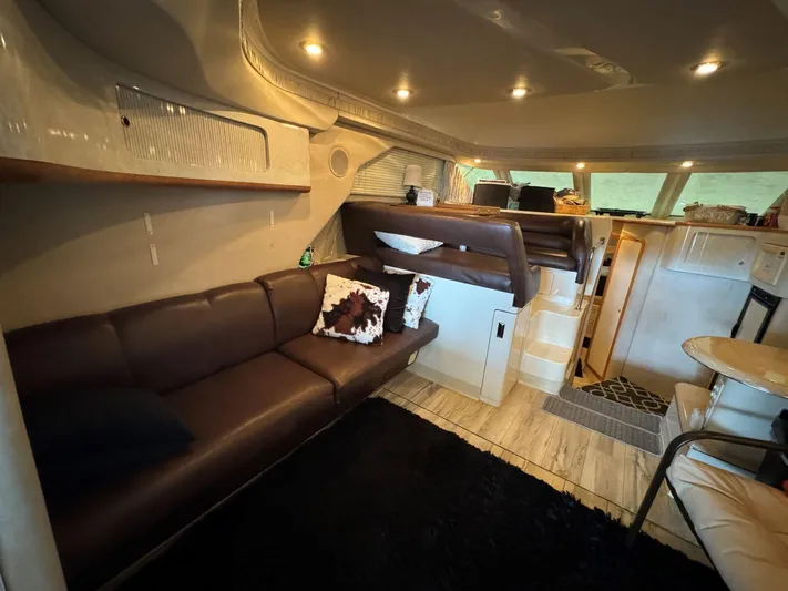  Yacht Photos Pics Interior of 1996 Sea Ray 400 Sedan Bridge with cozy seating and modern lighting.