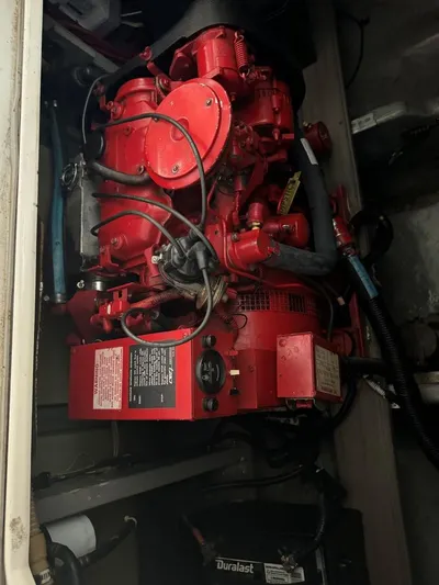  Yacht Photos Pics Engine compartment of a 1996 Sea Ray 400 Sedan Bridge with red machinery.