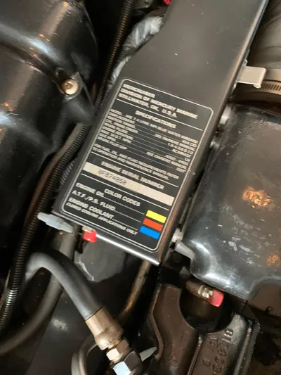  Yacht Photos Pics Engine compartment of 1996 Sea Ray 400 Sedan Bridge with specifications label.