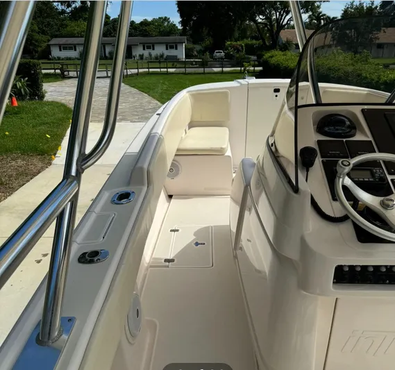  Yacht Photos Pics 2001 Intrepid 327 Center Console boat interior with steering wheel and seating.