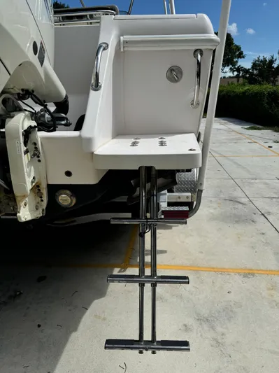  Yacht Photos Pics 2001 Intrepid 327 Center Console boat with extended swim ladder and platform.