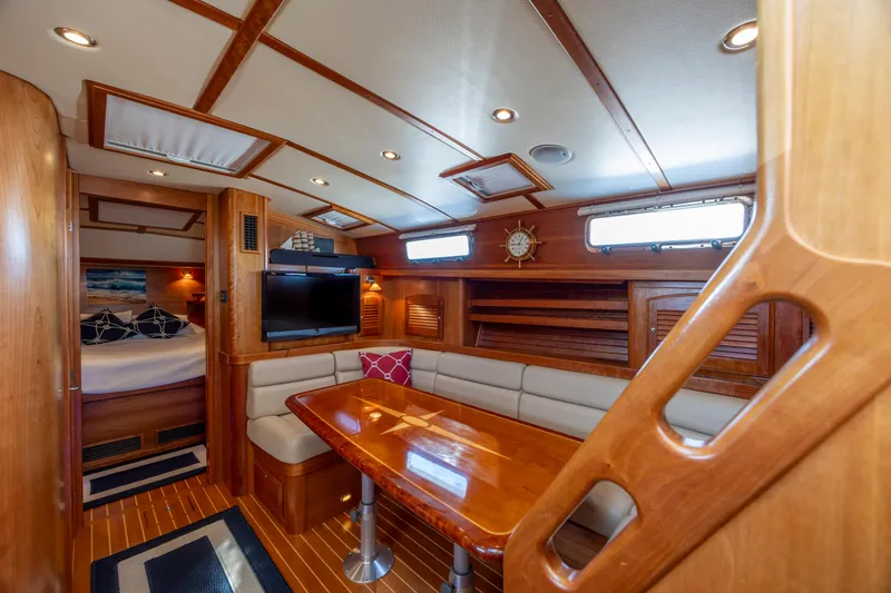  Yacht Photos Pics Luxurious interior of 2009 Sabre 42 Express yacht with wood finish and cozy seating area.