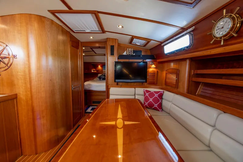  Yacht Photos Pics Luxurious interior of 2009 Sabre 42 Express yacht with wood finish and cozy seating.
