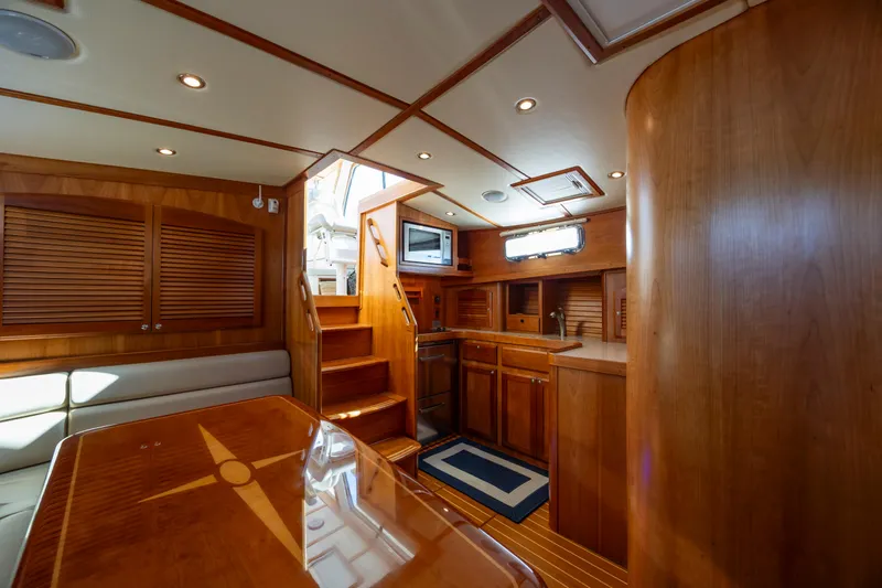  Yacht Photos Pics Luxurious interior of 2009 Sabre 42 Express yacht with wooden finishes and modern amenities.