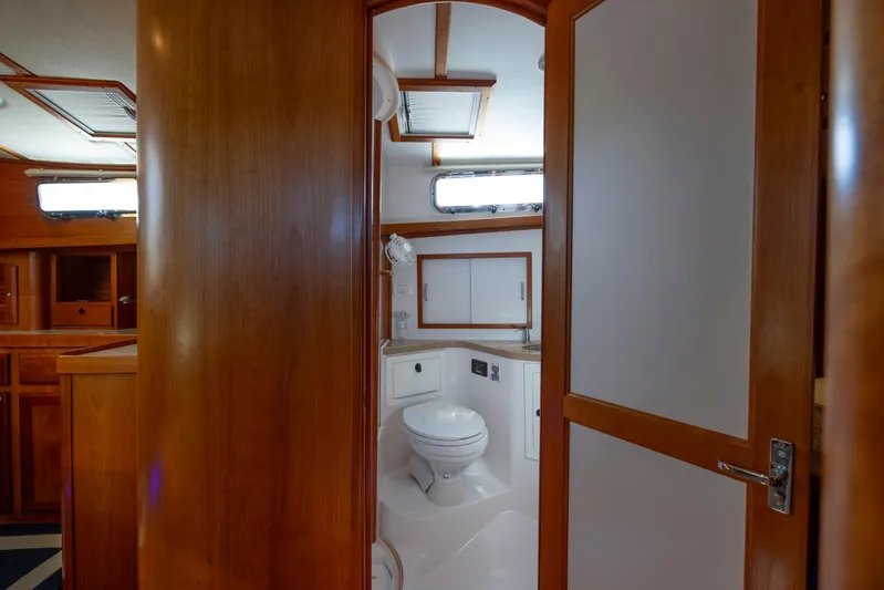  Yacht Photos Pics Interior view of 2009 Sabre 42 Express yacht bathroom with wooden finishes.