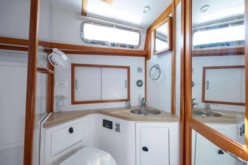  Yacht Photos Pics 2009 Sabre 42 Express yacht bathroom with wood accents and modern fixtures.