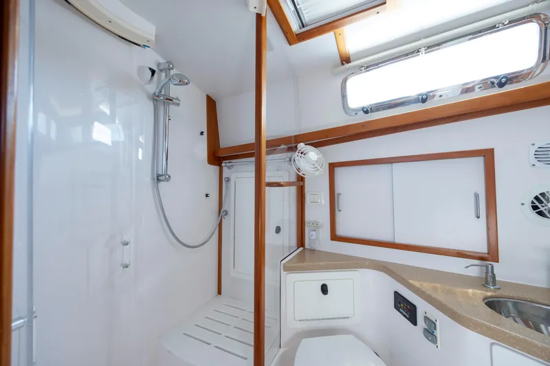  Yacht Photos Pics Luxurious bathroom in 2009 Sabre 42 Express yacht with shower and sink.