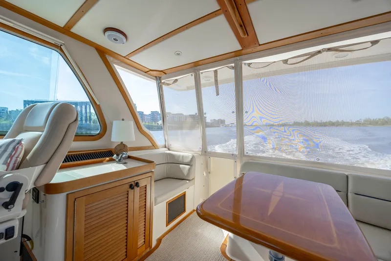  Yacht Photos Pics Interior of 2009 Sabre 42 Express yacht with elegant seating and wooden accents.