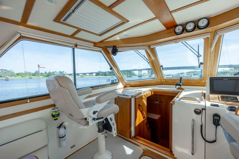  Yacht Photos Pics Interior of 2009 Sabre 42 Express yacht with helm station and panoramic windows.