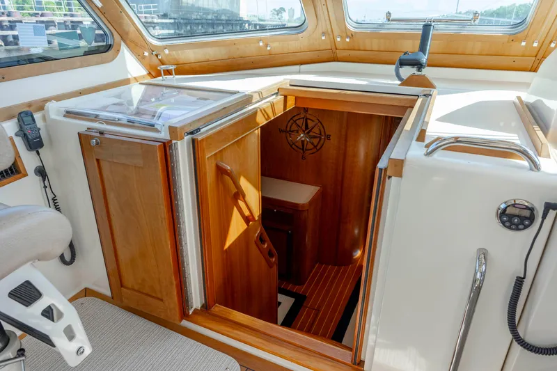  Yacht Photos Pics 2009 Sabre 42 Express yacht interior with wooden cabin entrance and nautical decor.