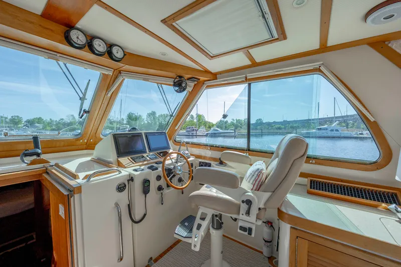  Yacht Photos Pics 2009 Sabre 42 Express helm with panoramic windows and modern navigation equipment.