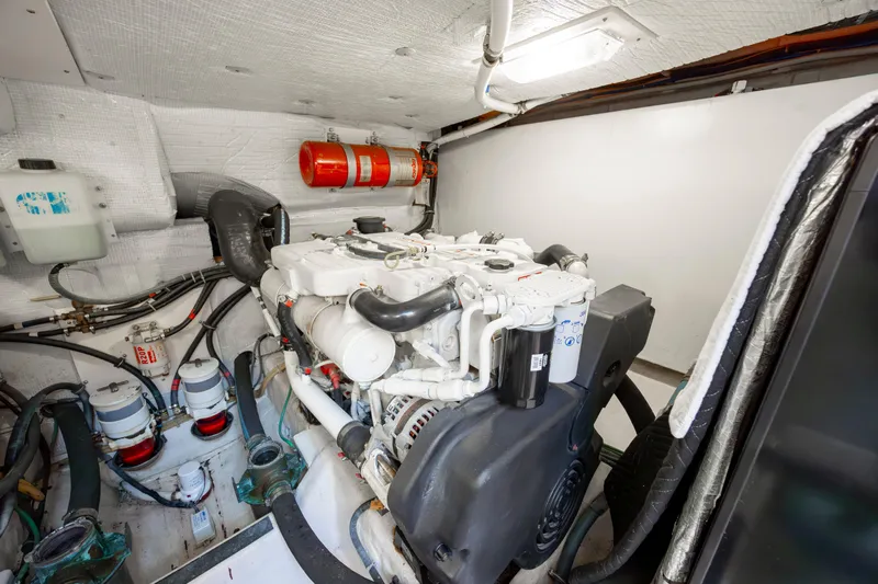  Yacht Photos Pics Engine room of 2009 Sabre 42 Express yacht, featuring a well-maintained engine and fire extinguisher.