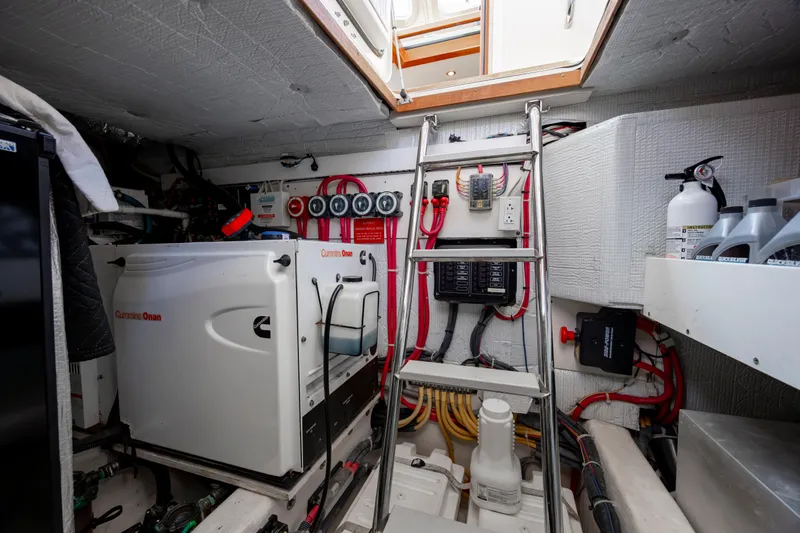  Yacht Photos Pics Engine room of 2009 Sabre 42 Express yacht, featuring equipment and access ladder.