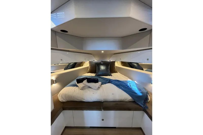 Celebrate Life Yacht Photos Pics Luxurious cabin interior of 2021 Steeler Bronson 50 yacht with cozy bedding.