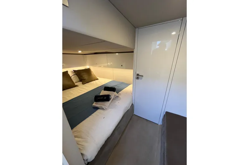 Celebrate Life Yacht Photos Pics Luxurious bedroom interior of 2021 Steeler Bronson 50 yacht with cozy bedding.