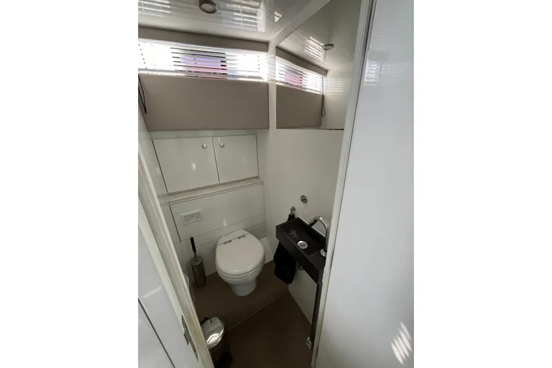 Celebrate Life Yacht Photos Pics Bathroom interior of 2021 Steeler Bronson 50 yacht, featuring modern fixtures and compact design.