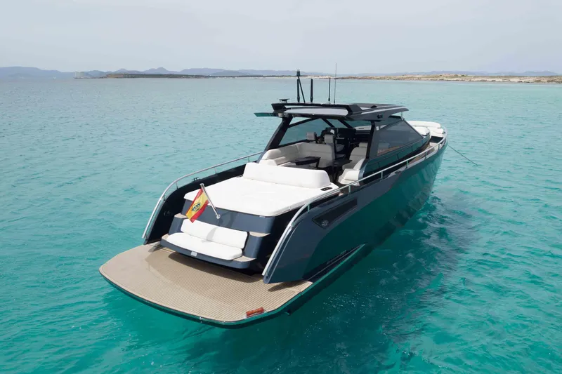 Celebrate Life Yacht Photos Pics Luxurious 2021 Steeler Bronson 50 yacht on turquoise waters, featuring sleek design and spacious deck.