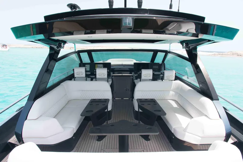 Celebrate Life Yacht Photos Pics Luxurious 2021 Steeler Bronson 50 yacht interior with white seating and sleek design.