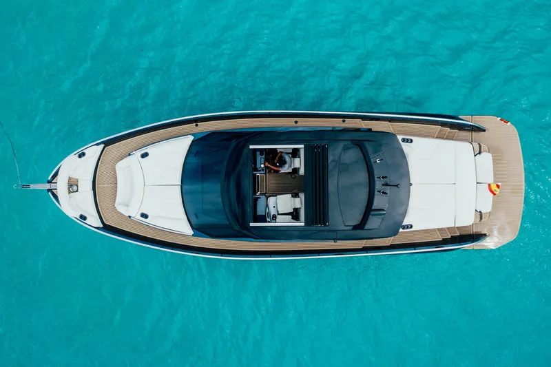 Celebrate Life Yacht Photos Pics Top view of 2021 Steeler Bronson 50 yacht on turquoise water.