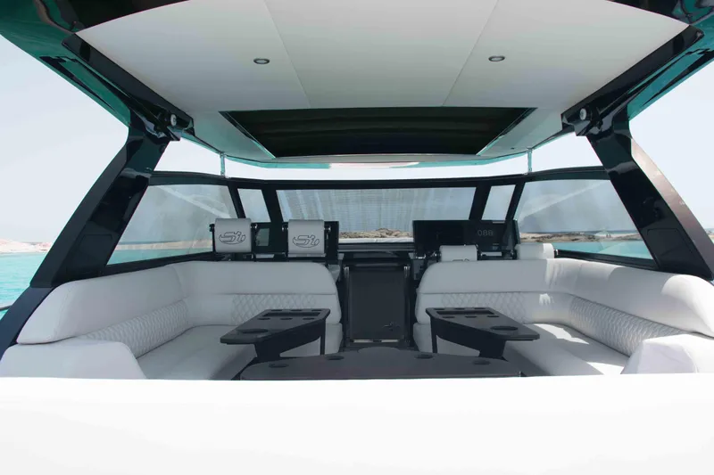 Celebrate Life Yacht Photos Pics Luxurious interior of 2021 Steeler Bronson 50 yacht with white seating and sleek design.