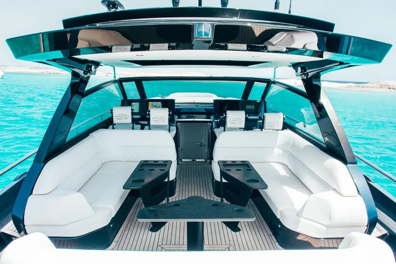 Celebrate Life Yacht Photos Pics Luxurious 2021 Steeler Bronson 50 yacht interior with white seating and sleek design.