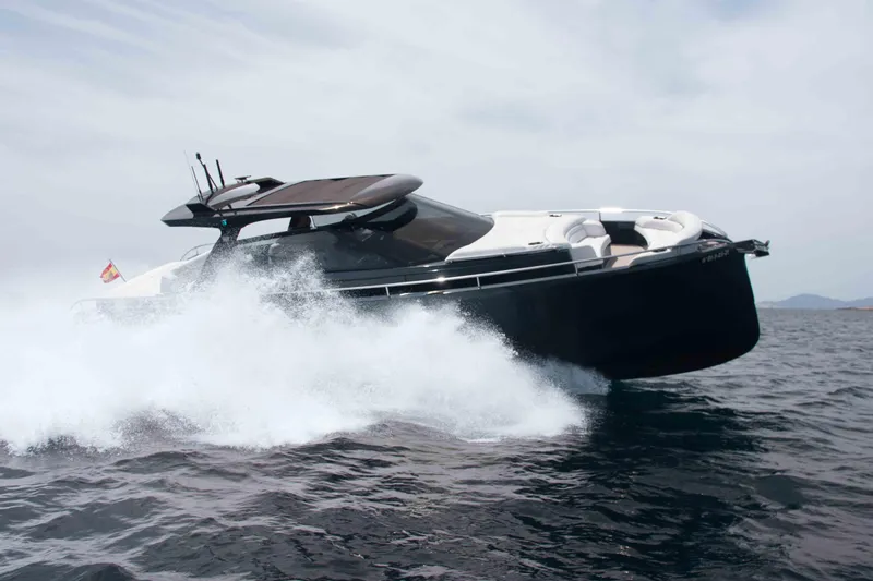 Celebrate Life Yacht Photos Pics Steeler Bronson 50 yacht cruising on open water, 2021 model, creating a dynamic splash.