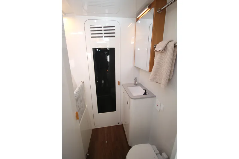Build To Order Yacht Photos Pics Modern bathroom interior of 2026 Chris White Spindrift 47 yacht, featuring sleek design elements.