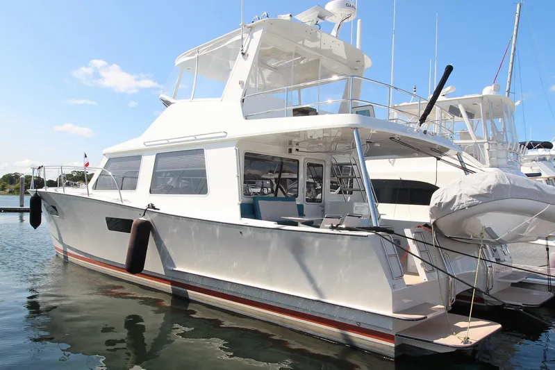 Build To Order Yacht Photos Pics 2026 Chris White Spindrift 47 yacht docked at marina under clear blue sky.