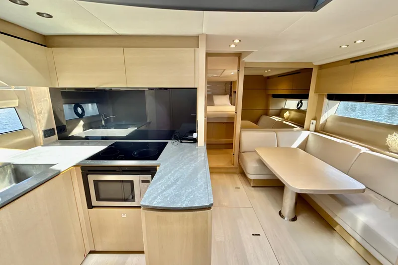 Il Capo Yacht Photos Pics Luxurious interior of 2017 Princess V58 yacht with modern kitchen and dining area.
