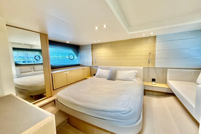 Il Capo Yacht Photos Pics Luxurious bedroom interior of 2017 Princess V58 yacht with modern design and cozy ambiance.