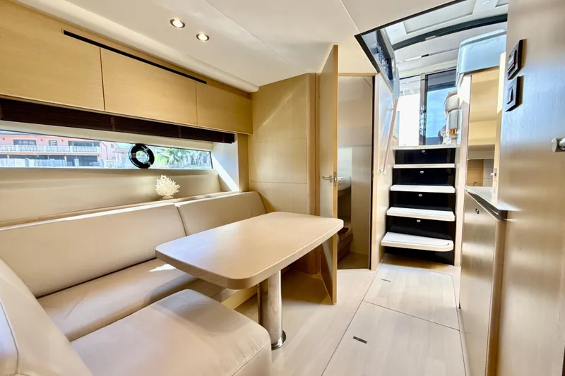Il Capo Yacht Photos Pics Luxurious interior of 2017 Princess V58 yacht with elegant seating and modern design.