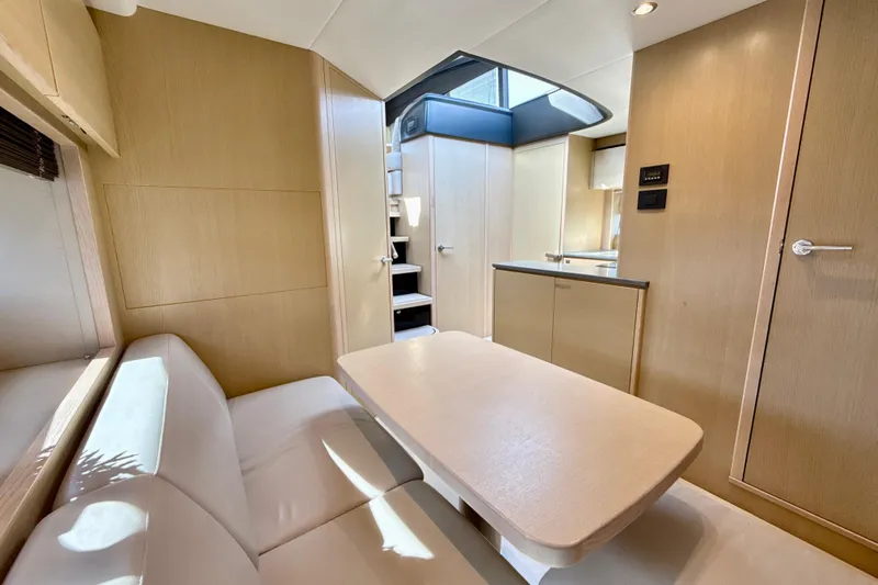 Il Capo Yacht Photos Pics Luxurious interior of 2017 Princess V58 yacht with modern seating and sleek design.