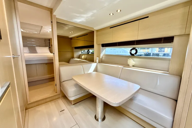 Il Capo Yacht Photos Pics Luxurious interior of 2017 Princess V58 yacht with elegant seating and modern decor.