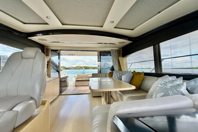 Il Capo Yacht Photos Pics Luxurious interior of 2017 Princess V58 yacht with elegant seating and scenic ocean view.