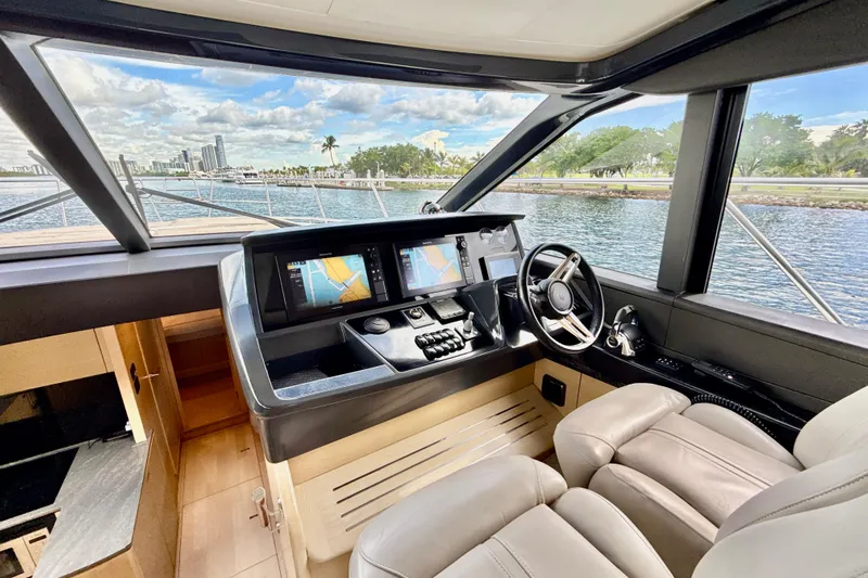 Il Capo Yacht Photos Pics Luxurious 2017 Princess V58 yacht cockpit with modern navigation system and waterfront view.