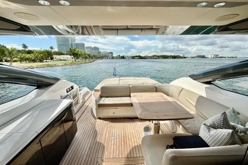 Il Capo Yacht Photos Pics Luxurious 2017 Princess V58 yacht interior with elegant seating and scenic waterfront view.