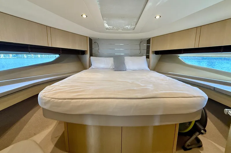 Il Capo Yacht Photos Pics Luxurious cabin interior of 2017 Princess V58 yacht with elegant bedding and modern design.