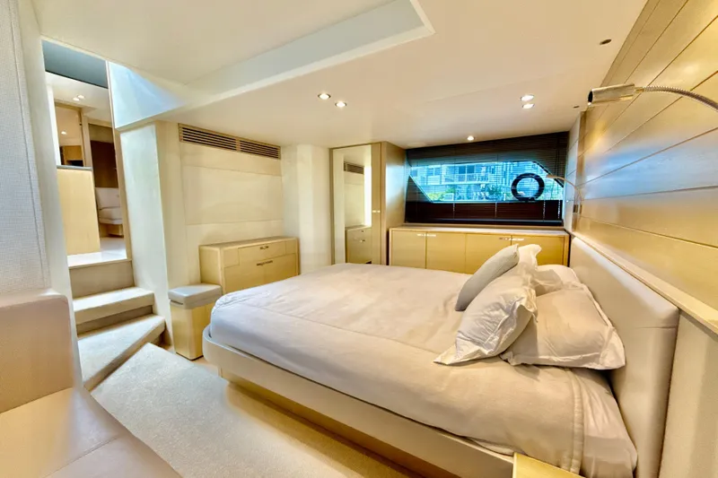Il Capo Yacht Photos Pics Luxurious bedroom interior of 2017 Princess V58 yacht with modern design and natural lighting.