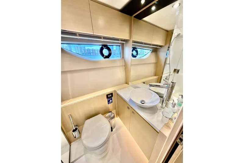 Il Capo Yacht Photos Pics Luxurious bathroom in 2017 Princess V58 yacht with modern fixtures and elegant design.