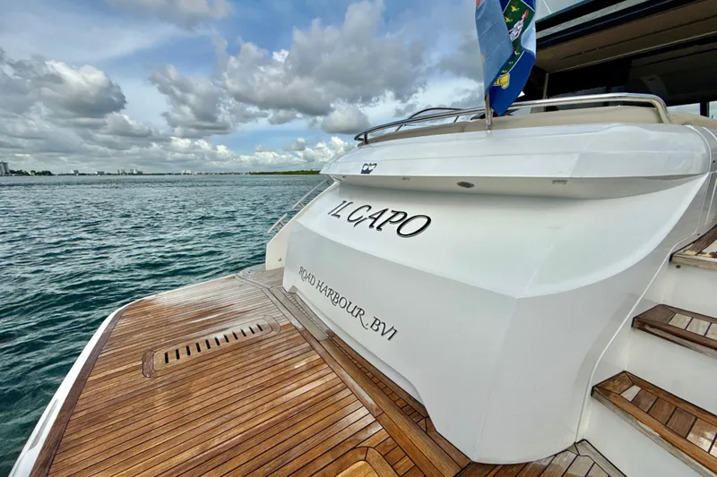 Il Capo Yacht Photos Pics 2017 Princess V58 yacht "Il Capo" docked at sea with wooden deck.