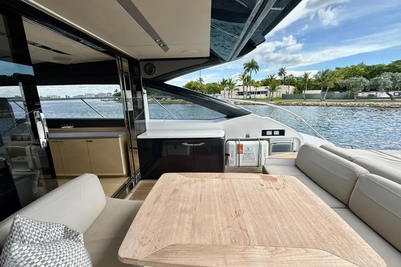 Il Capo Yacht Photos Pics Luxurious 2017 Princess V58 yacht interior with elegant seating and scenic waterfront view.