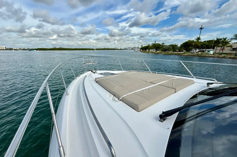 Il Capo Yacht Photos Pics 2017 Princess V58 yacht on calm water, featuring spacious deck and sunbathing area.